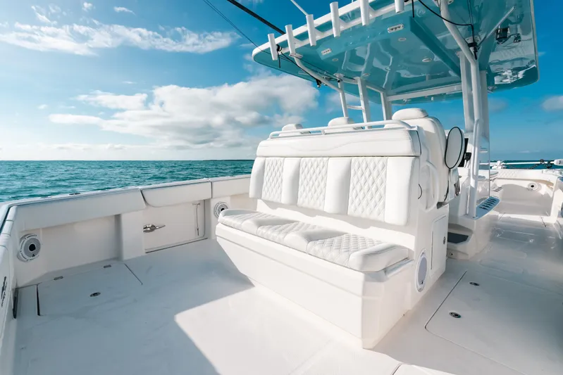  Yacht Photos Pics Invincible 37 Catamaran 2021 with luxurious seating, cruising on open ocean under blue sky.