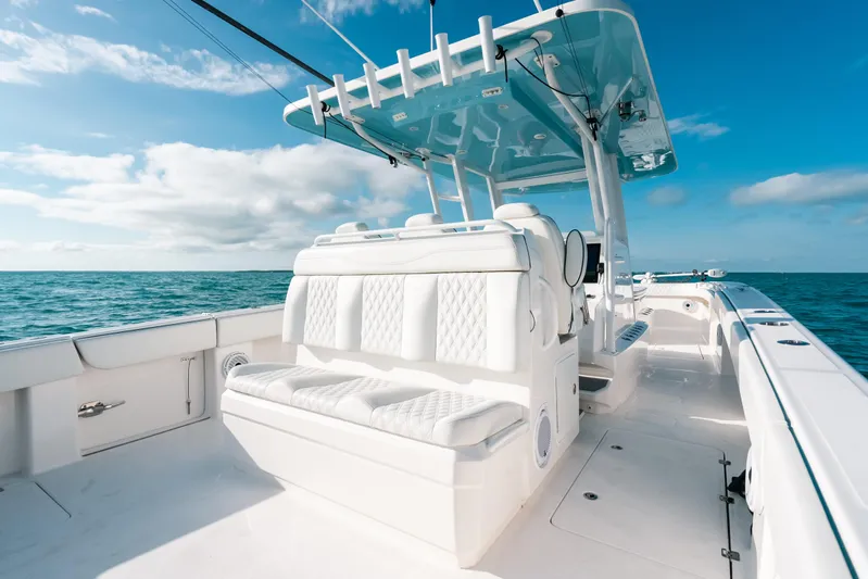  Yacht Photos Pics 2021 Invincible 37 Catamaran on open sea, featuring luxurious seating and sleek design.