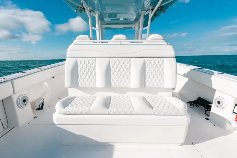  Yacht Photos Pics Luxury seating on 2021 Invincible 37 Catamaran, ocean backdrop, clear skies.