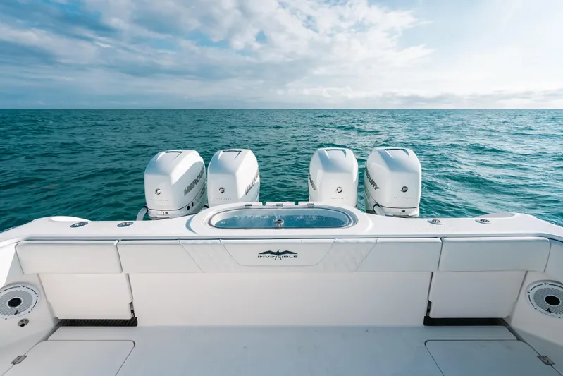  Yacht Photos Pics 2021 Invincible 37 Catamaran with four outboard engines on open sea.