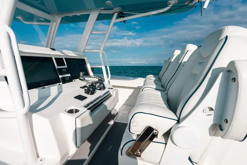  Yacht Photos Pics Luxurious interior of 2021 Invincible 37 Catamaran with modern helm and seating.