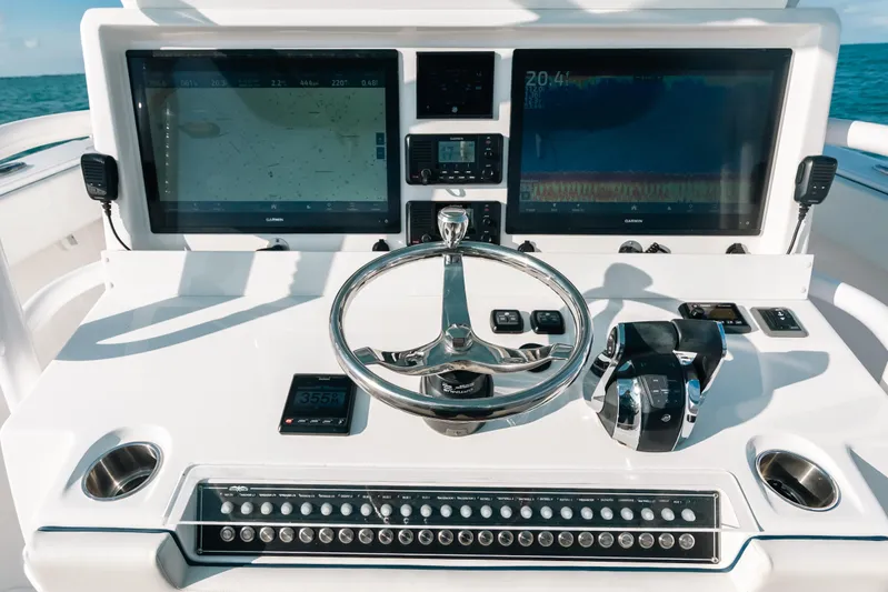  Yacht Photos Pics 2021 Invincible 37 Catamaran helm with dual displays and modern controls.