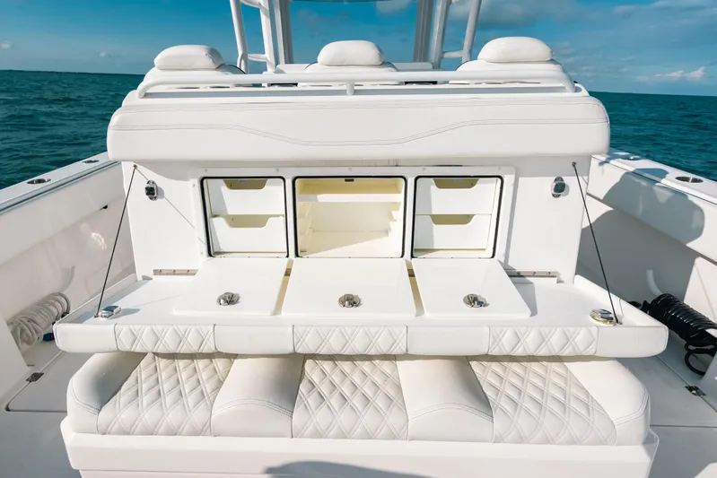  Yacht Photos Pics Luxury seating and storage on 2021 Invincible 37 Catamaran, ocean backdrop.