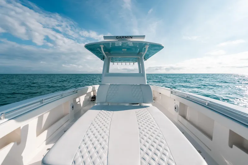  Yacht Photos Pics Invincible 37 Catamaran 2021 on open sea, featuring sleek design and luxurious seating.