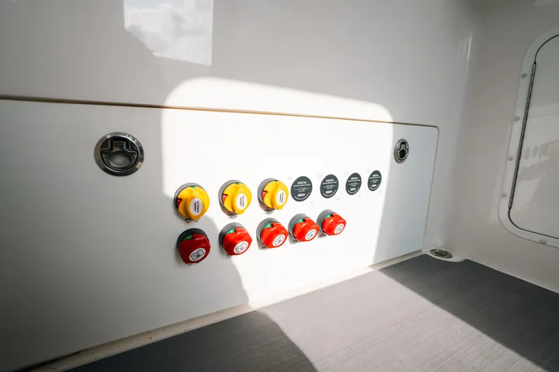  Yacht Photos Pics Control panel of 2021 Invincible 37 Catamaran with switches and dials.