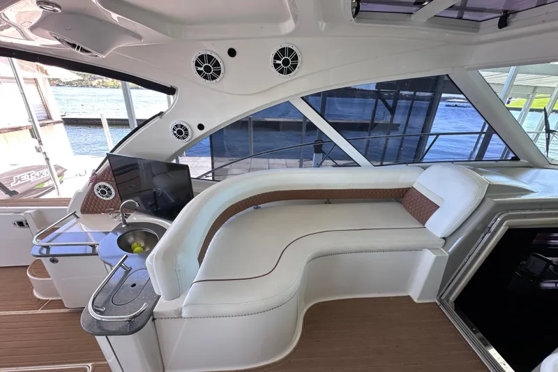  Yacht Photos Pics Luxurious interior of 2005 Sea Ray 48 Sundancer yacht with plush seating and modern amenities.