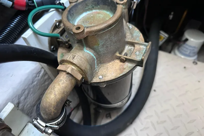  Yacht Photos Pics Engine component of 2005 Sea Ray 48 Sundancer, showing metal fittings and hoses.