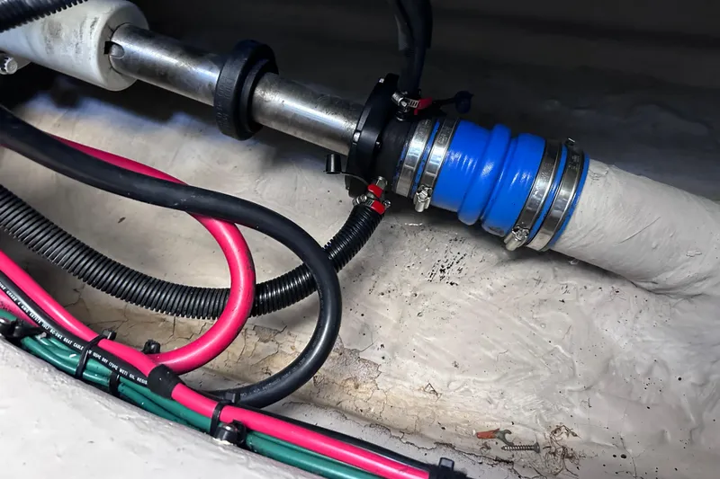  Yacht Photos Pics Engine compartment of 2005 Sea Ray 48 Sundancer with cables and hose connections.