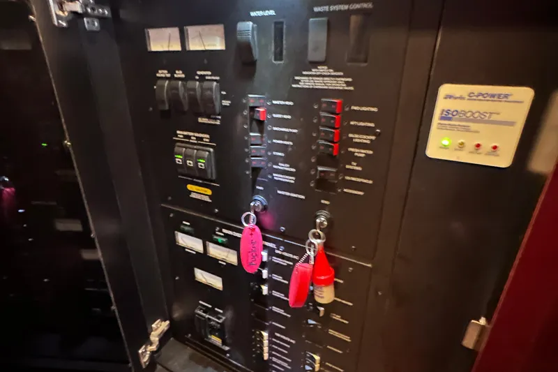  Yacht Photos Pics Control panel of a 2005 Sea Ray 48 Sundancer yacht with labeled switches and keys.