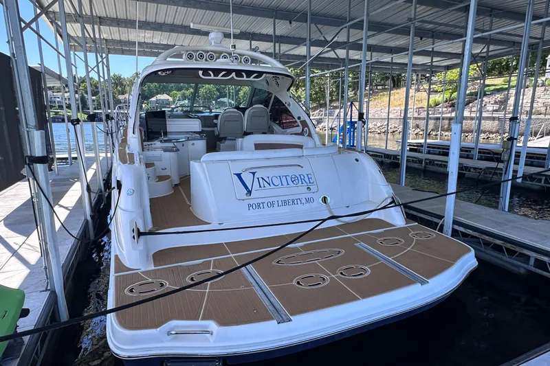  Yacht Photos Pics 2005 Sea Ray 48 Sundancer docked, rear view, with "Vincitore" and "Port of Liberty, MO" displayed.