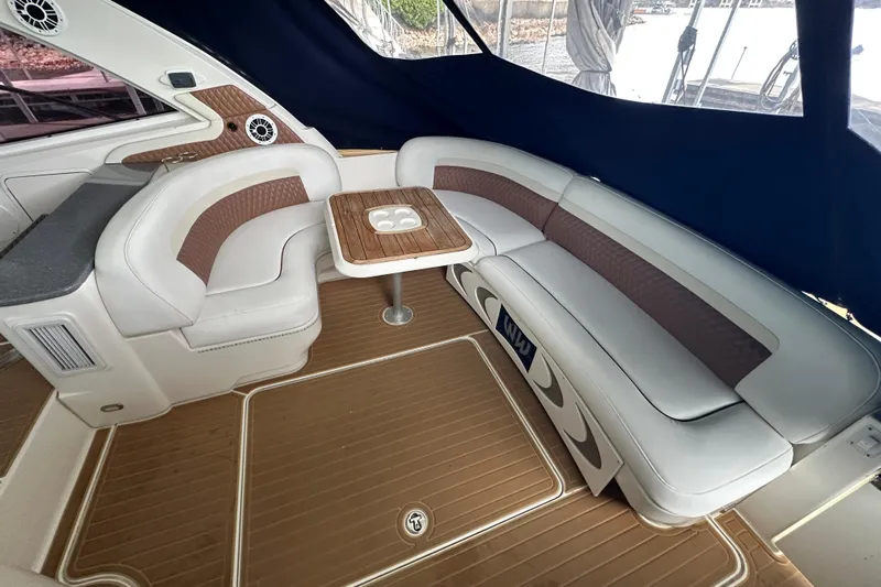  Yacht Photos Pics 2005 Sea Ray 48 Sundancer interior with elegant seating and wooden table.