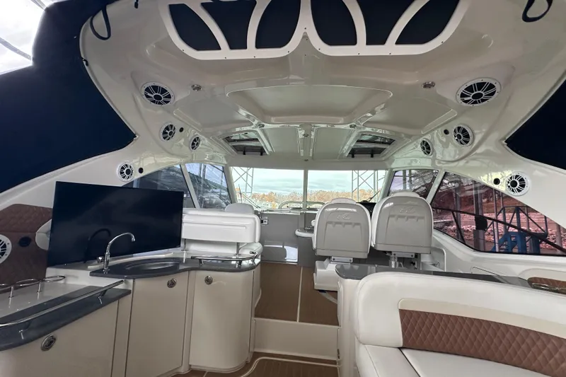  Yacht Photos Pics Luxurious interior of 2005 Sea Ray 48 Sundancer yacht with modern amenities and seating.