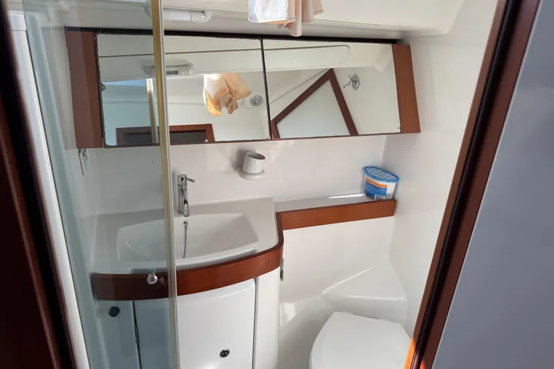 Eos Yacht Photos Pics Bathroom interior of 2008 Beneteau Oceanis 40 yacht, featuring sink and mirror.