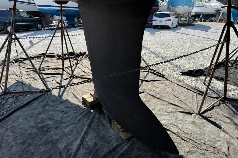 Eos Yacht Photos Pics Keel of a 2008 Beneteau Oceanis 40 sailboat in a boatyard setting.