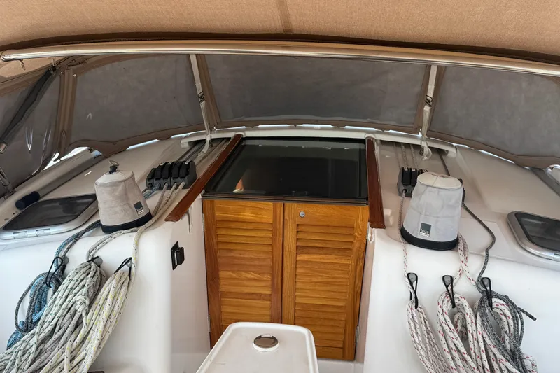 Eos Yacht Photos Pics 2008 Beneteau Oceanis 40 yacht cockpit with ropes and wooden hatch.