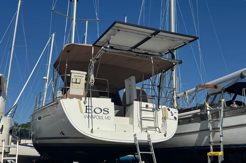 Eos Yacht Photos Pics 2008 Beneteau Oceanis 40 sailboat docked in Annapolis, MD, with solar panels and ladder.