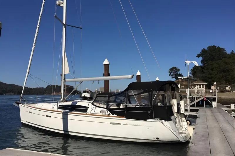Eos Yacht Photos Pics 2008 Beneteau Oceanis 40 sailboat docked at a marina under clear blue skies.
