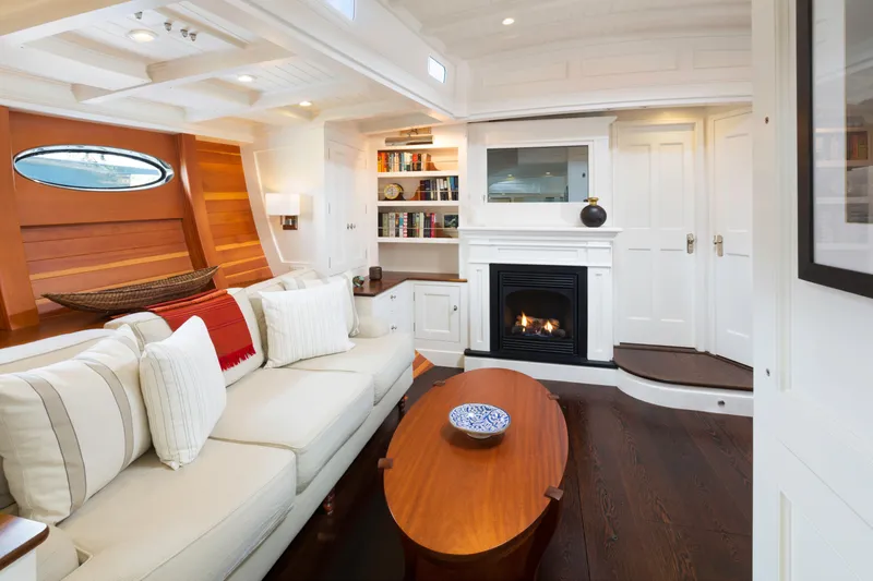 Bequia Yacht Photos Pics Luxurious 2009 Brooklin Boat Yard interior with cozy fireplace and elegant furnishings.