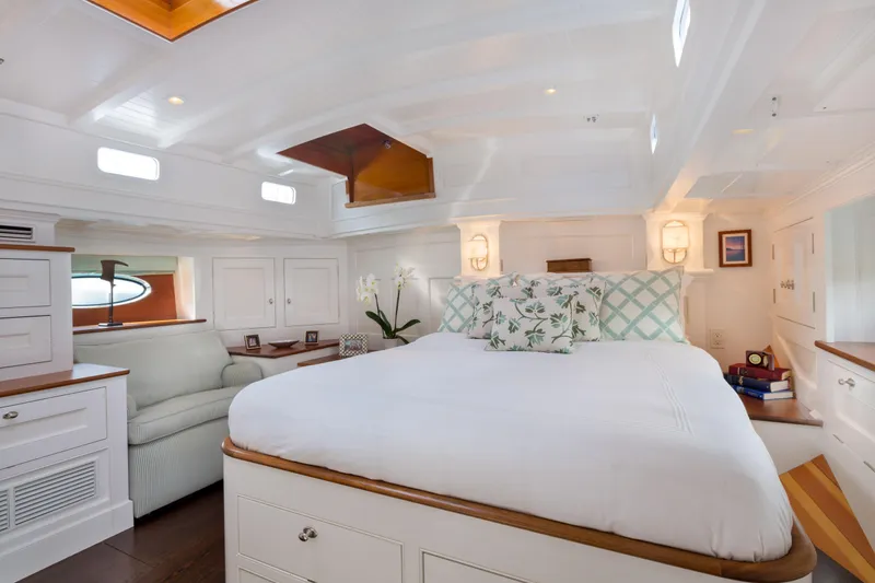 Bequia Yacht Photos Pics Luxurious 2009 Brooklin Boat Yard cabin interior with elegant white decor and cozy bedding.