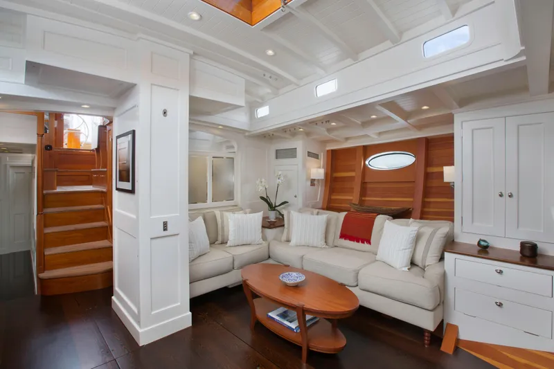 Bequia Yacht Photos Pics Luxurious 2009 Brooklin Boat Yard interior with elegant white and wood design, cozy seating area.