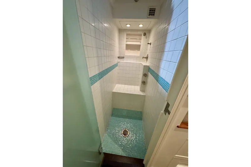 Bequia Yacht Photos Pics Compact shower with white tiles and turquoise accents, Brooklin Boat Yard 2009 model.