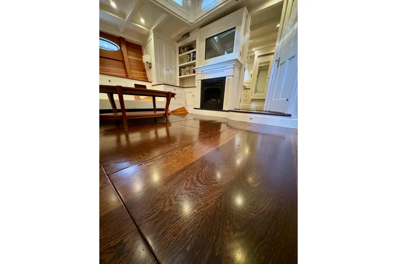 Bequia Yacht Photos Pics Luxurious interior of 2009 Brooklin Boat Yard model with polished wood flooring.