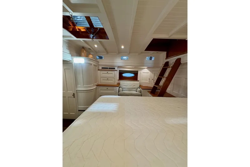 Bequia Yacht Photos Pics Luxurious 2009 Brooklin Boat Yard interior with elegant woodwork and cozy seating area.