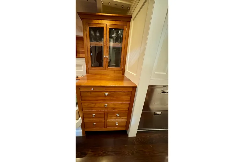 Bequia Yacht Photos Pics Wooden cabinet with glass doors and drawers, crafted by Brooklin Boat Yard, 2009 model.