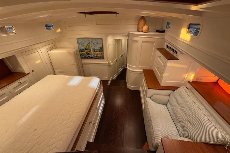 Bequia Yacht Photos Pics Luxurious 2009 Brooklin Boat Yard interior with elegant wood finishes and cozy seating area.