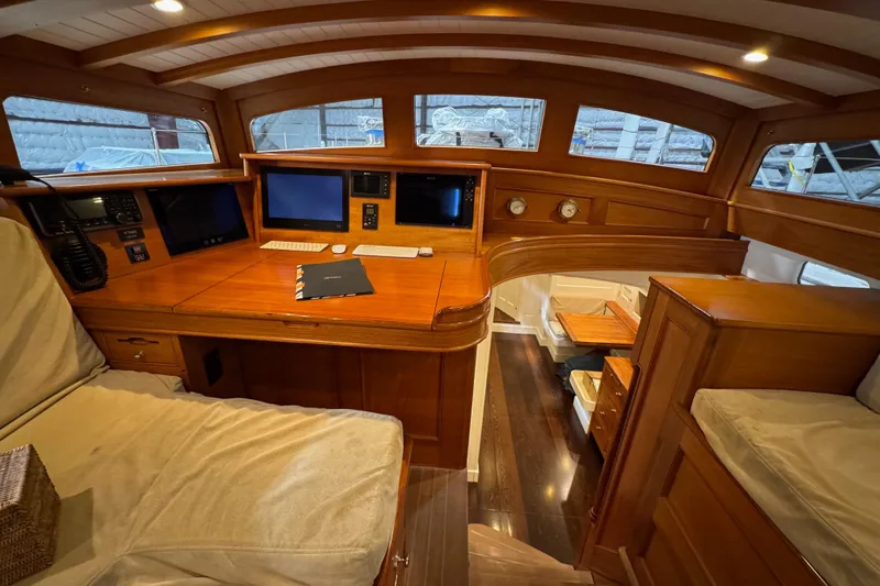 Bequia Yacht Photos Pics Luxurious 2009 Brooklin Boat Yard interior with wood finish and navigation equipment.