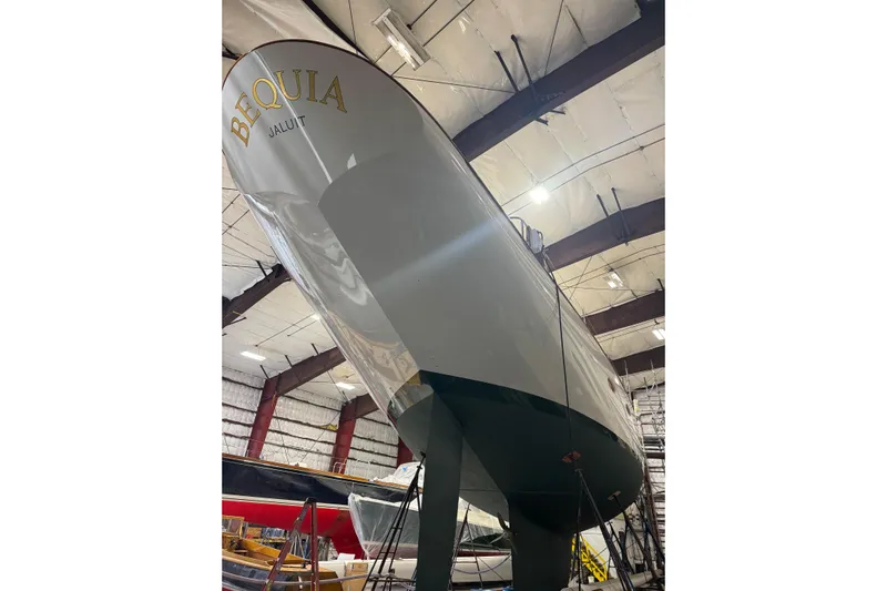 Bequia Yacht Photos Pics Brooklin Boat Yard 2009 model yacht in a storage facility, showcasing sleek design.