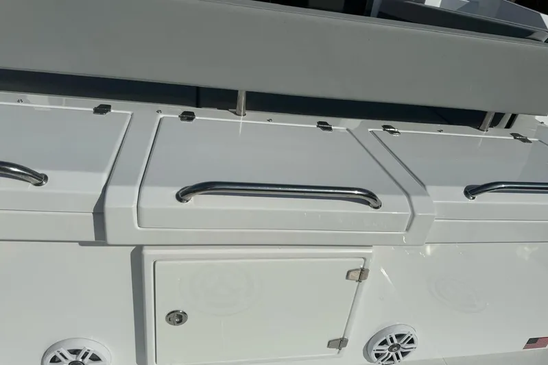  Yacht Photos Pics 2022 Cruisers Yachts 42 Cantius deck with storage compartments and stainless steel handles.