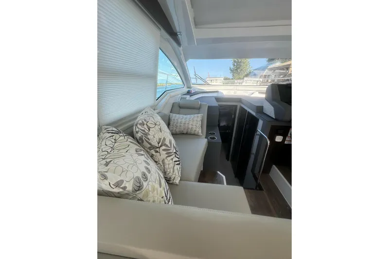  Yacht Photos Pics Interior of 2022 Cruisers Yachts 42 Cantius with plush seating and decorative pillows.