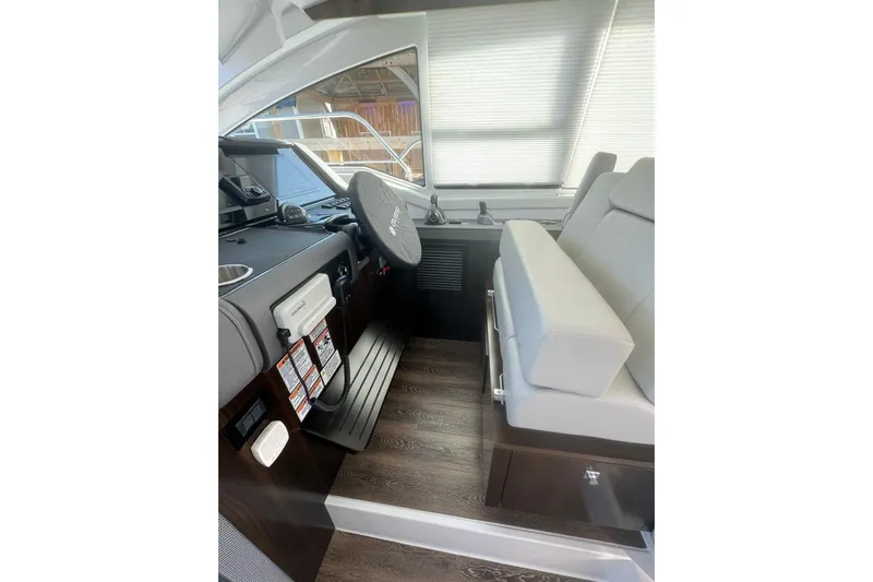  Yacht Photos Pics Interior helm of 2022 Cruisers Yachts 42 Cantius with modern controls and seating.