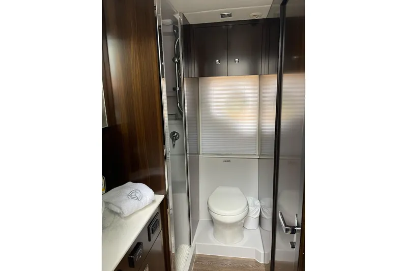  Yacht Photos Pics Luxurious bathroom in 2022 Cruisers Yachts 42 Cantius with modern fixtures and elegant design.