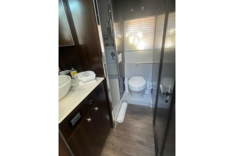  Yacht Photos Pics Luxurious bathroom in 2022 Cruisers Yachts 42 Cantius with modern fixtures and elegant design.