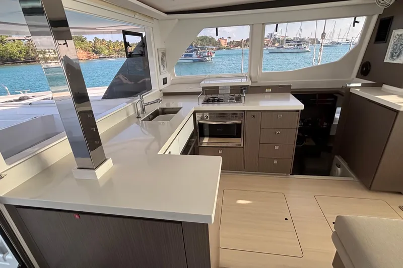  Yacht Photos Pics Modern kitchen interior of 2022 Leopard 45 yacht with ocean view.
