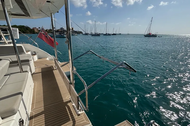  Yacht Photos Pics Leopard 45 yacht deck overlooking serene ocean with sailboats, 2022 model.