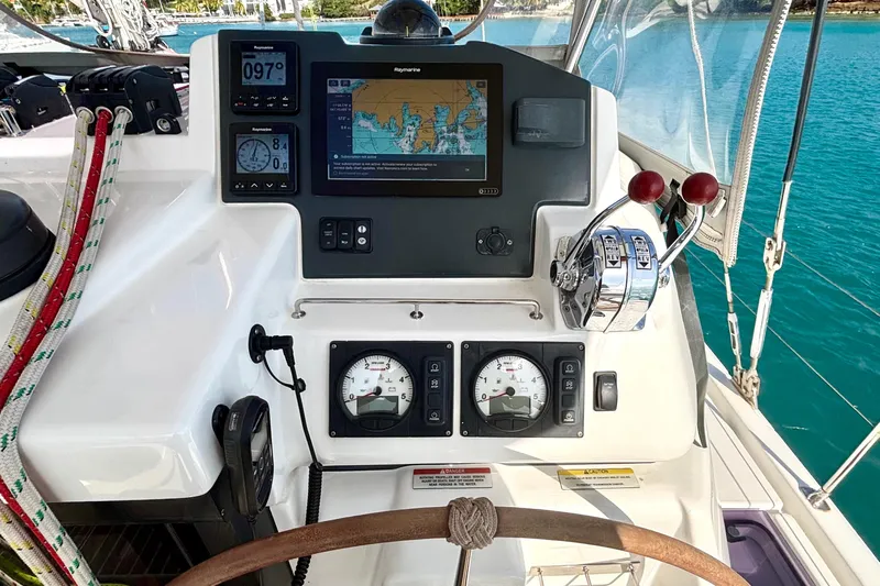  Yacht Photos Pics Helm of 2022 Leopard 45 catamaran with navigation instruments and controls.