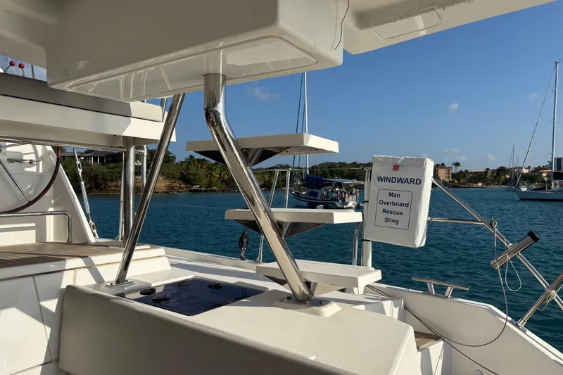  Yacht Photos Pics Leopard 45 yacht deck with rescue sling, 2022 model, docked in sunny marina.