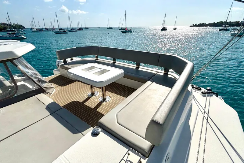  Yacht Photos Pics Luxurious 2022 Leopard 45 yacht with spacious deck seating, overlooking serene ocean waters.
