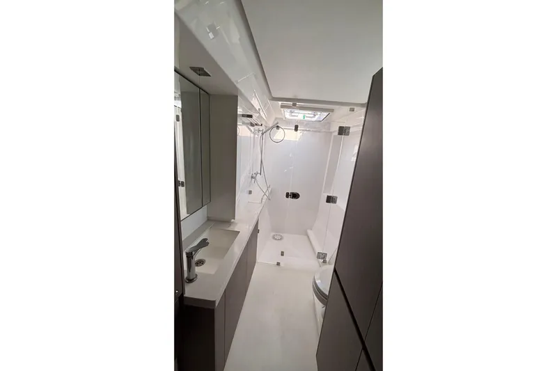  Yacht Photos Pics Modern bathroom interior in 2022 Leopard 45 yacht, featuring sleek design and fixtures.