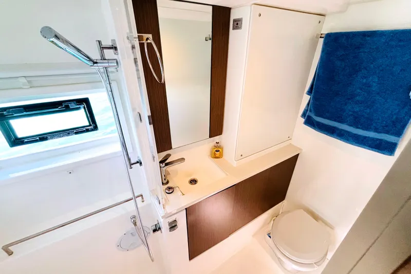  Yacht Photos Pics Modern bathroom in 2022 Leopard 45 yacht with shower, sink, and toilet.