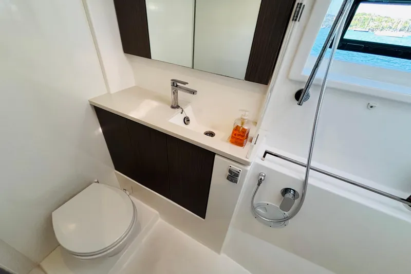  Yacht Photos Pics Modern bathroom in 2022 Leopard 45 yacht with sleek fixtures and ocean view.