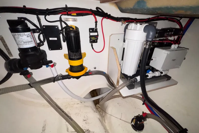  Yacht Photos Pics Engine room of a 2022 Leopard 45 yacht with various mechanical components.