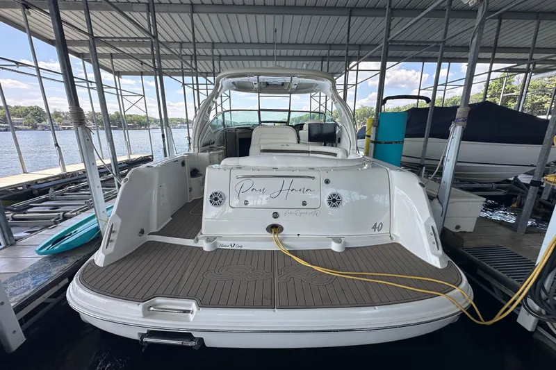  Yacht Photos Pics 2007 Sea Ray 40 Sundancer docked in a marina, rear view with open cockpit.