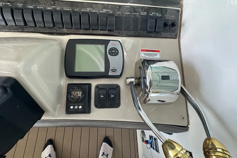  Yacht Photos Pics Control panel of a 2007 Sea Ray 40 Sundancer boat with throttle and navigation display.