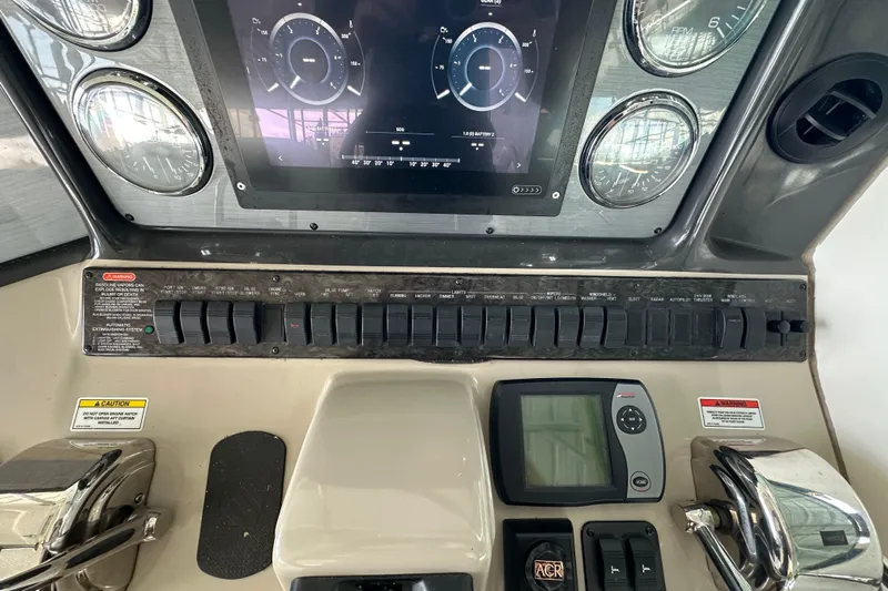 Yacht Photos Pics Control panel of a 2007 Sea Ray 40 Sundancer boat with gauges and switches.