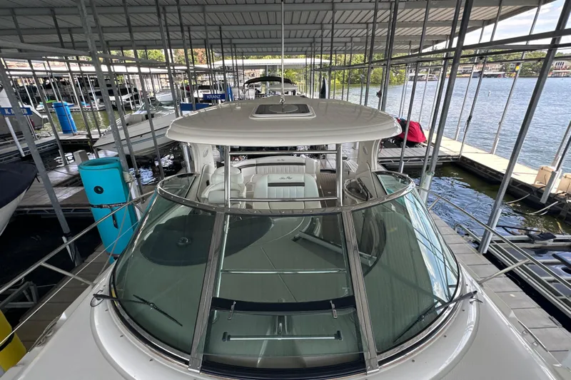  Yacht Photos Pics 2007 Sea Ray 40 Sundancer yacht docked in a marina, showcasing sleek design and spacious deck.