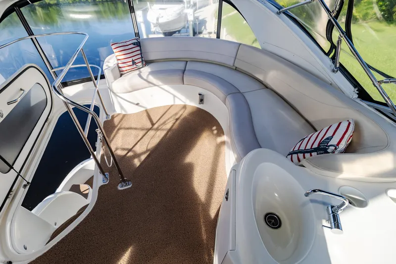  Yacht Photos Pics Luxurious 2009 Meridian 391 Sedan yacht interior with curved seating and scenic water view.